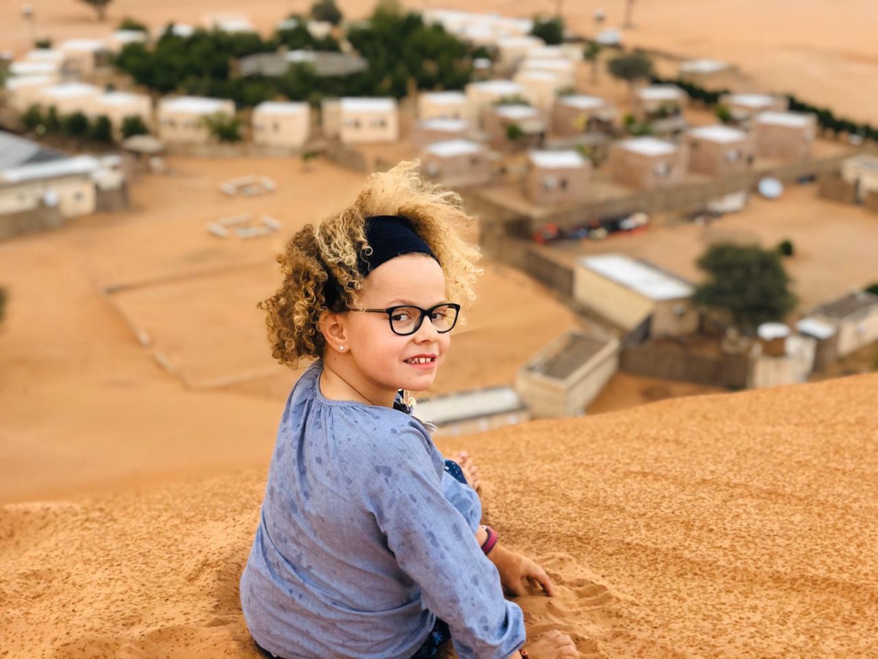 YOUNG TOURISTS IN OMAN DESERTS